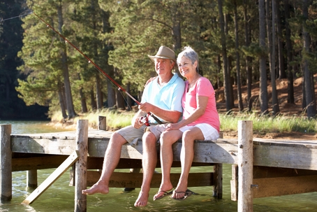 Senior couple fishing on dock